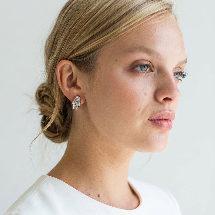 Close-up of bridal model wearing delicate Rasha Earrings with Austrian crystals, soft natural lighting highlighting their refined design.